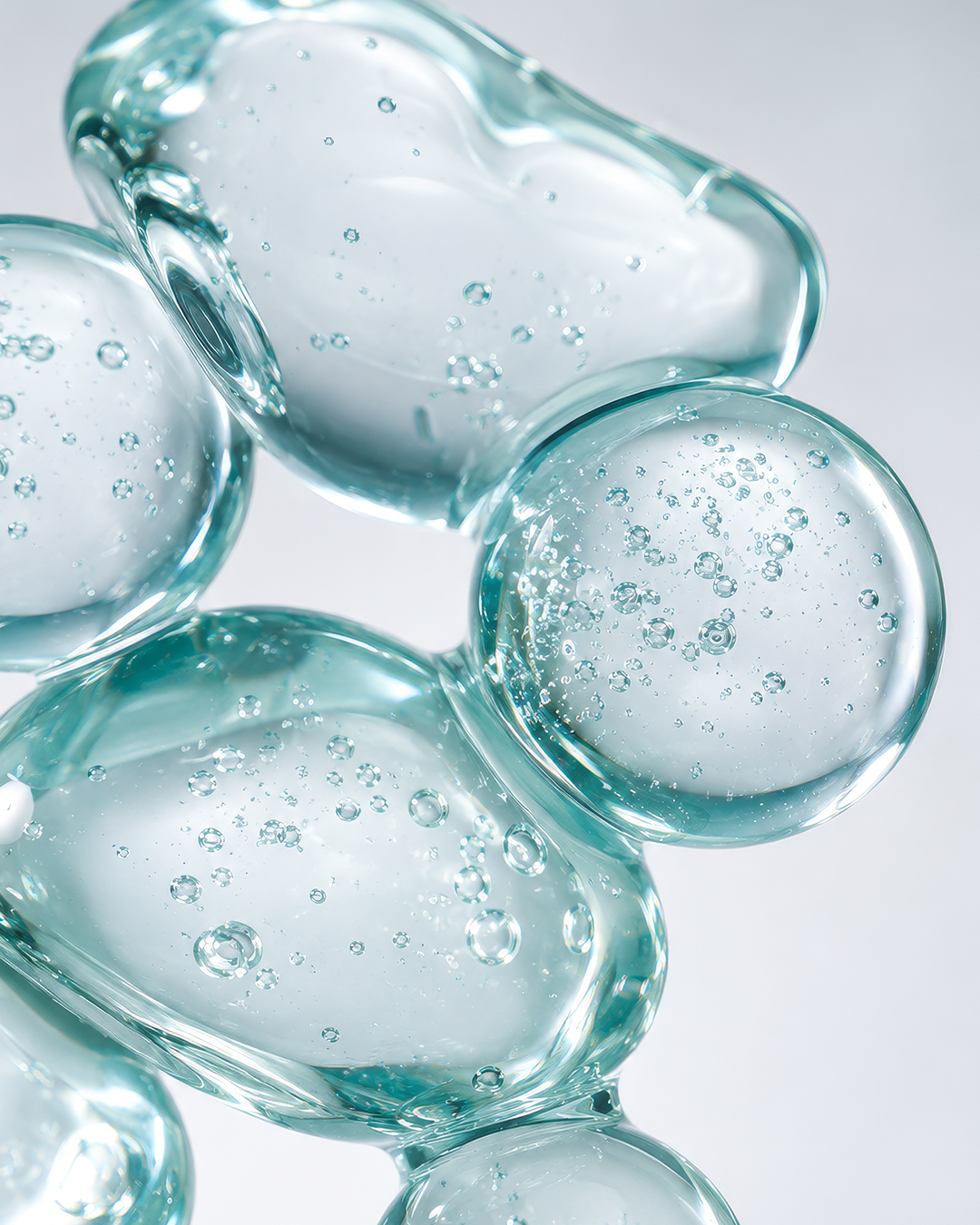 Close-up of translucent gel spheres with suspended air bubbles