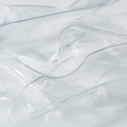 Close-up of transparent hydrogel mask sheets layered to highlight their smooth, ultra-thin texture
