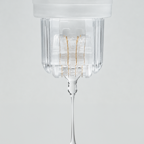 Close-up of the Roller Gold device dispensing a clear serum through its gold-plated micro-needle roller head